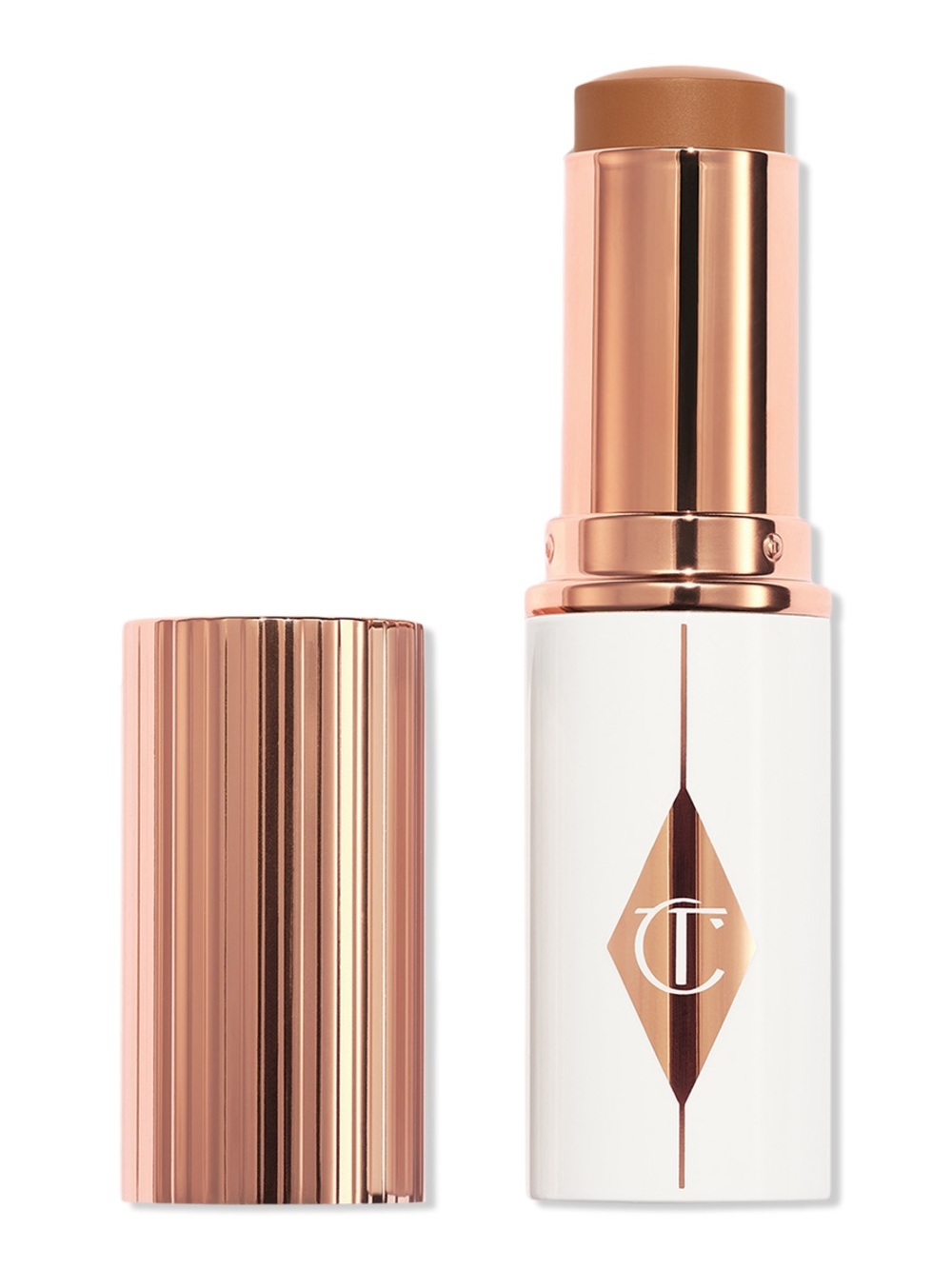 CHARLOTTE TILBURY Unreal Skin Sheer Glow Tint Foundation Stick In 12.5 Tan